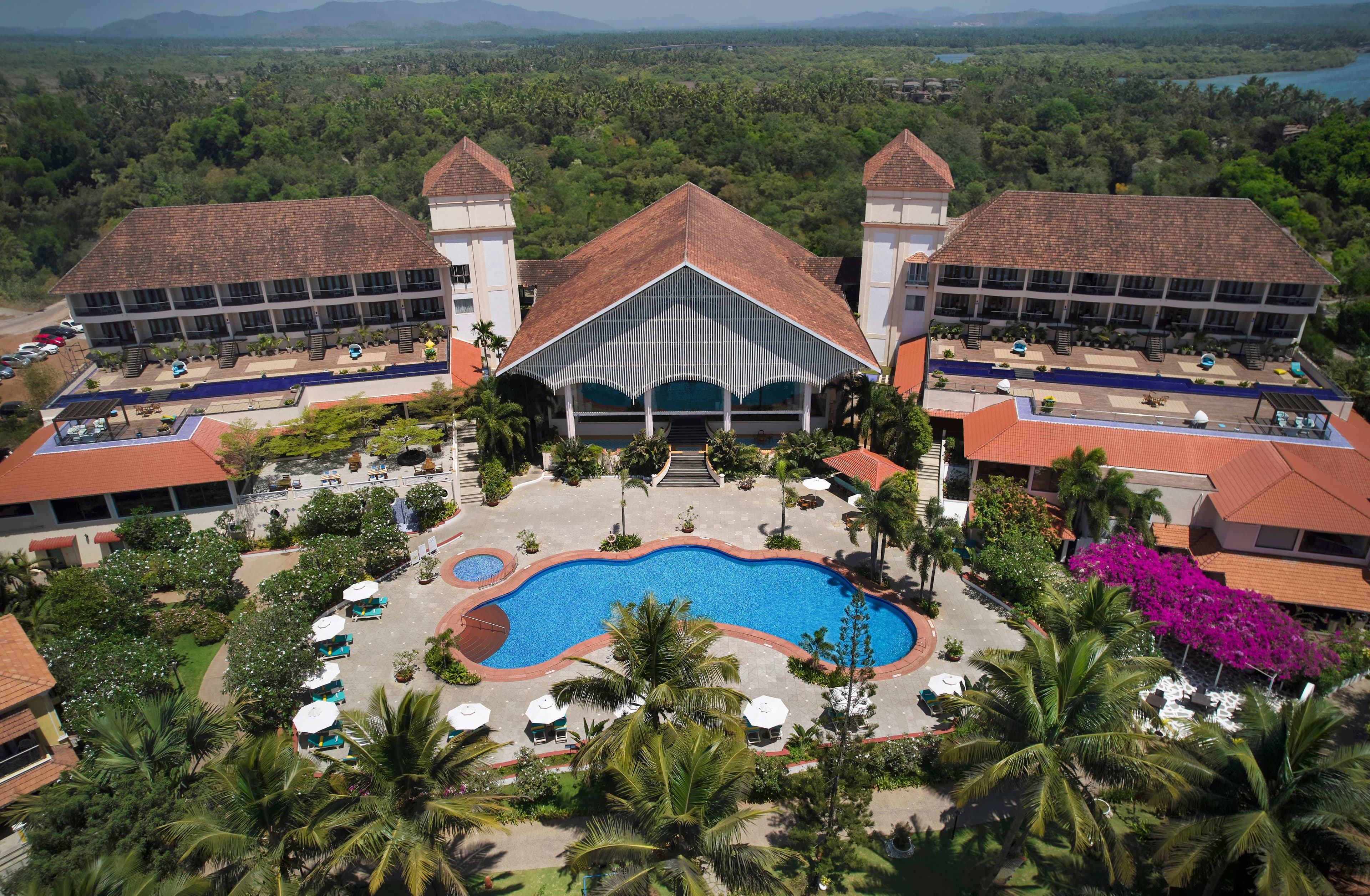 Radisson Blu Goa resort pool at dusk